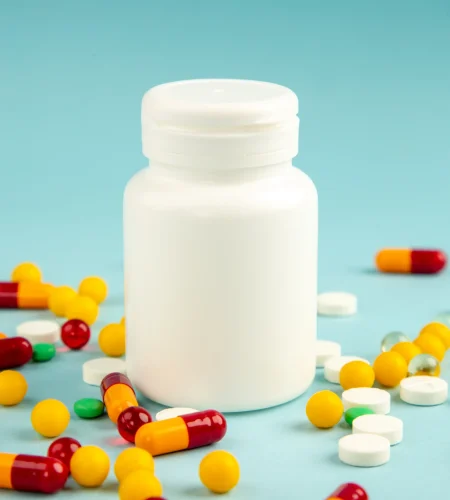 front-view-different-colorful-pills-with-plastic-can-blue-surface-lab-health-covid-hospital-science-pandemic-drug-color